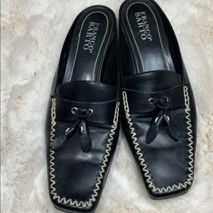 Franco Sarto black and white square toe slides.